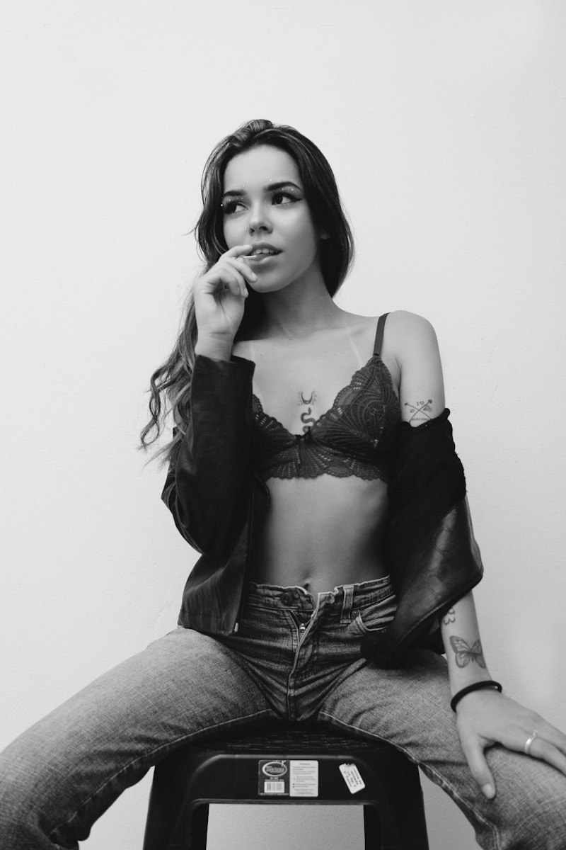 Photo by Marlon Alves a black and white photo of a woman smoking a cigarette